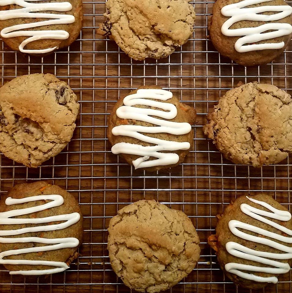 Two different types of cookies: carrot cake and oatmeal raisin in an assorted pattern.